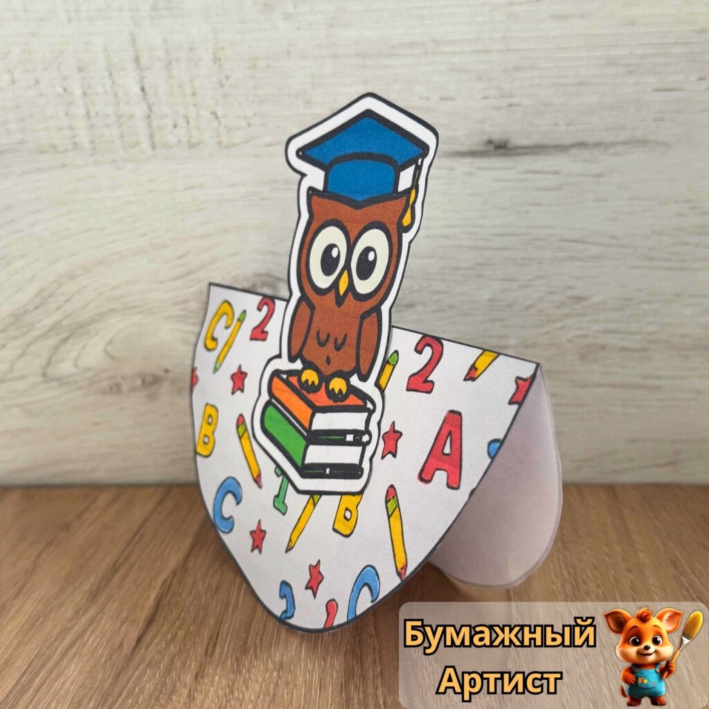 Качающаяся сова-неваляшка из бумаги на подставке ракурс сбоку